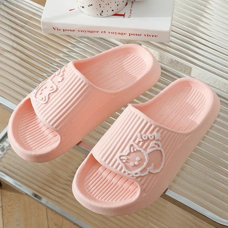 Women's green cat slippers with thick EVA platform sole on a wooden floor