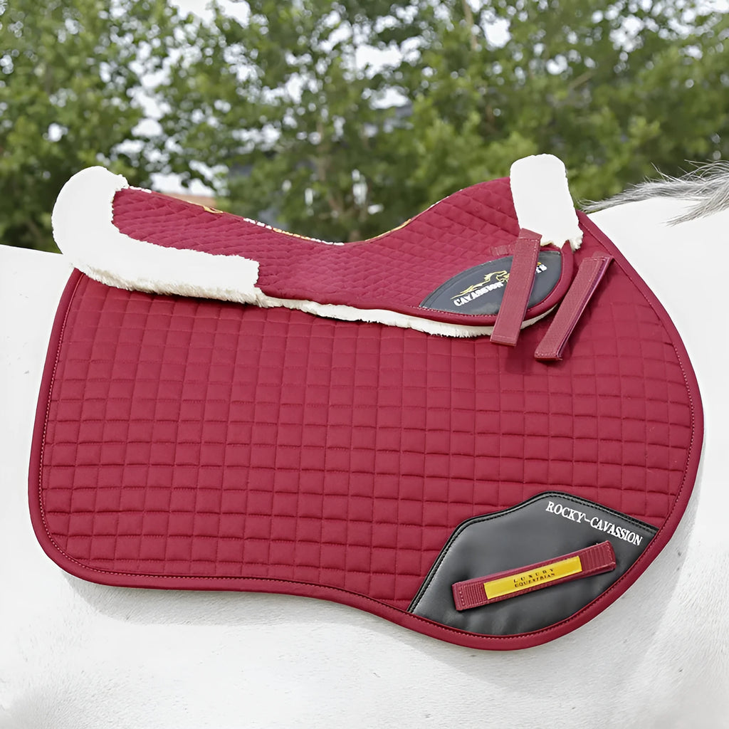 Riding saddle pad for equestrian and cycling with shock absorption and balance features in wine red colour.