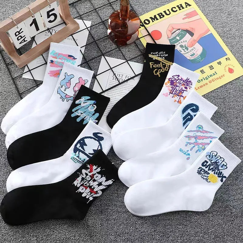 10 pairs of white cotton tube socks with graffiti pattern, middle calf length, on a plain background