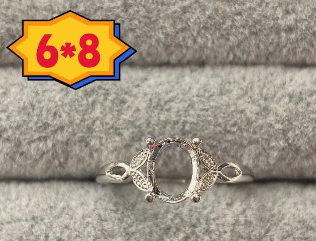 Oval denier ring ornament with 6x8mm stone, open mouth design, and five-pointed star detail