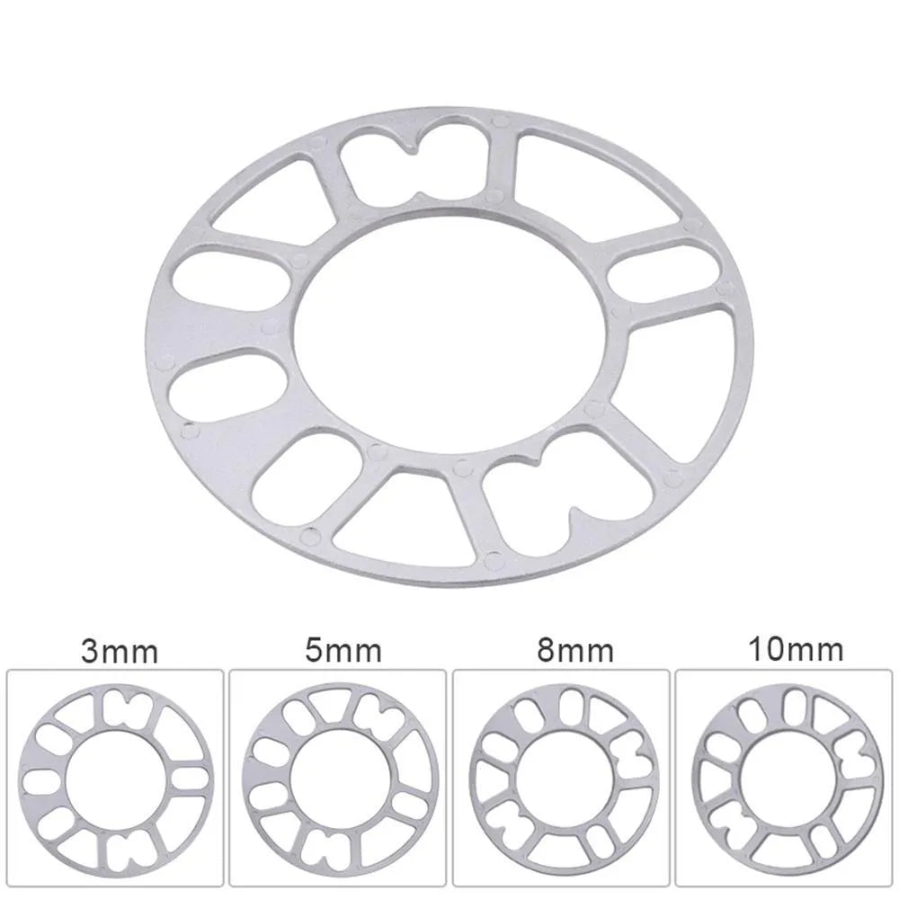 A metallic wheel hub widening gasket or spacer in various thicknesses for automotive modification.