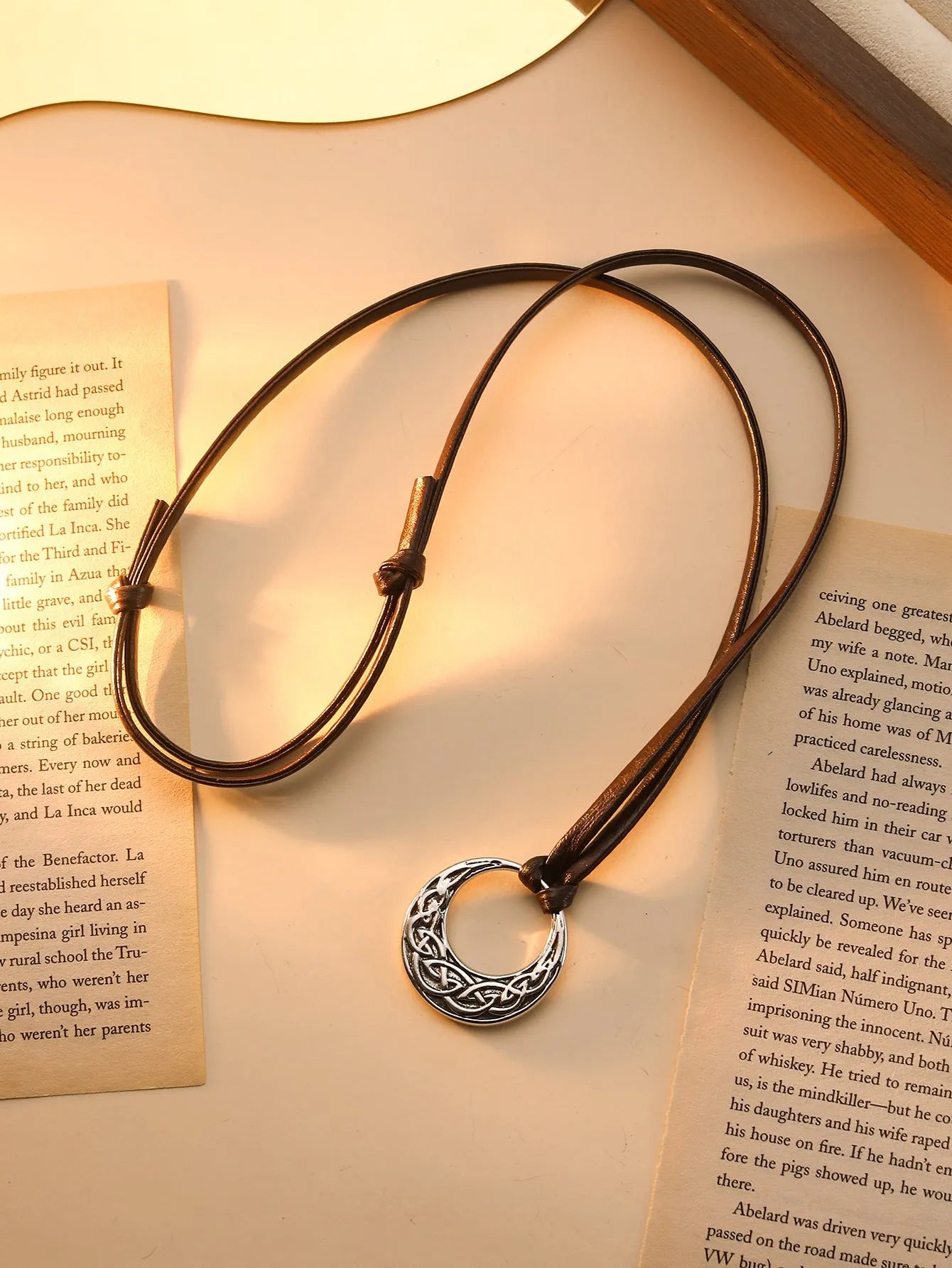 Alloy skull pendant necklace with adjustable knot chain in antique silver on a neutral background