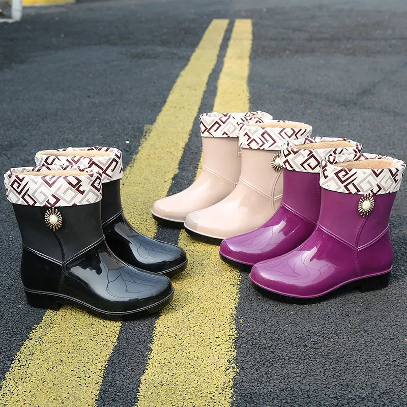 Women's mid-length PVC rain boots in purple, black, or beige with non-slip sole