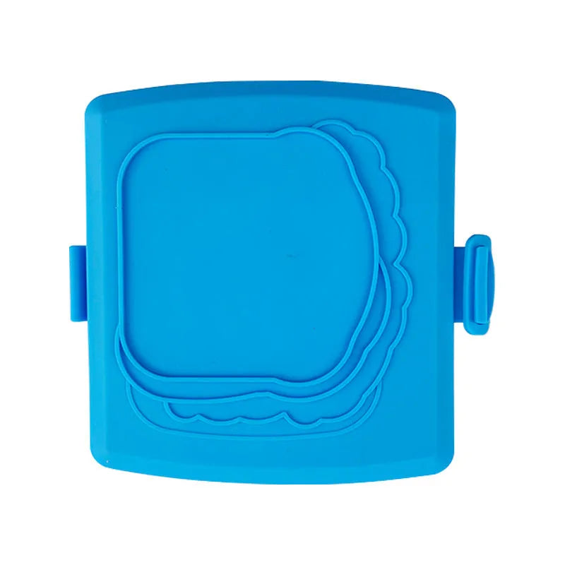 Red silicone baking tray shaped like a handbag with matching heat-resistant oven gloves