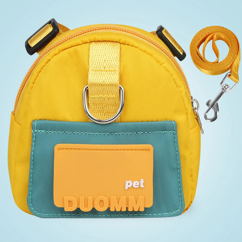 Blue adjustable dog harness with integrated backpack and attached tow rope on a medium-sized dog