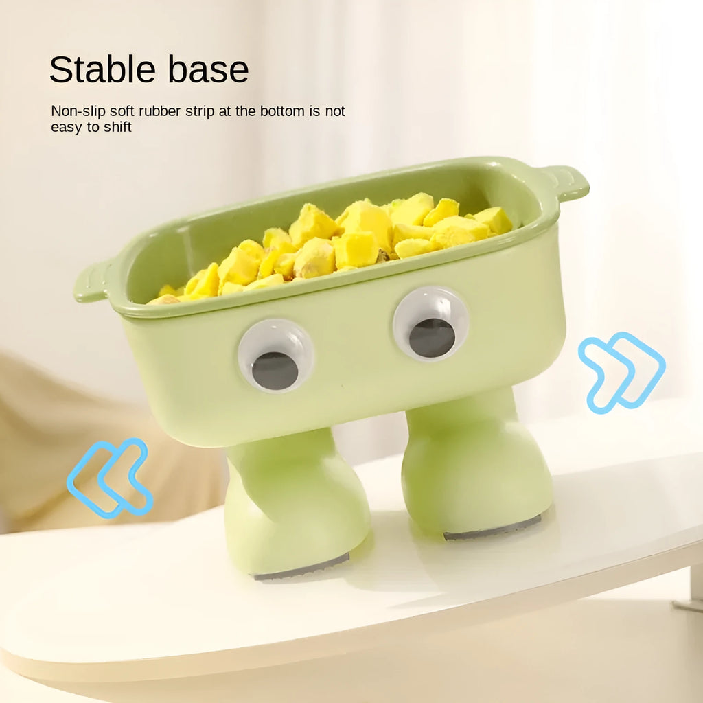 Green robot-shaped tilted cat bowl with detachable inner dish on a non-slip base.