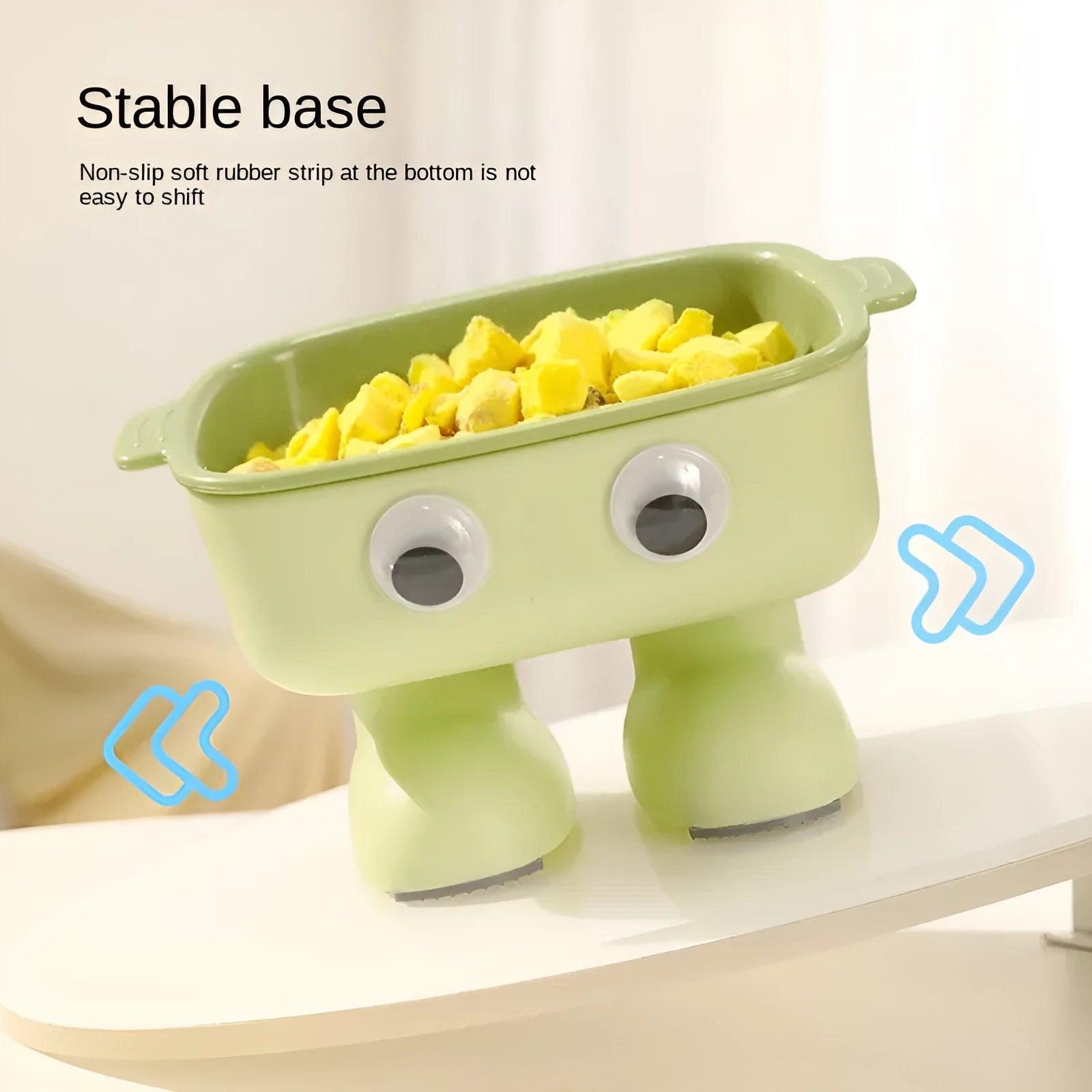 Green robot-shaped tilted cat bowl with detachable inner dish on a non-slip base.