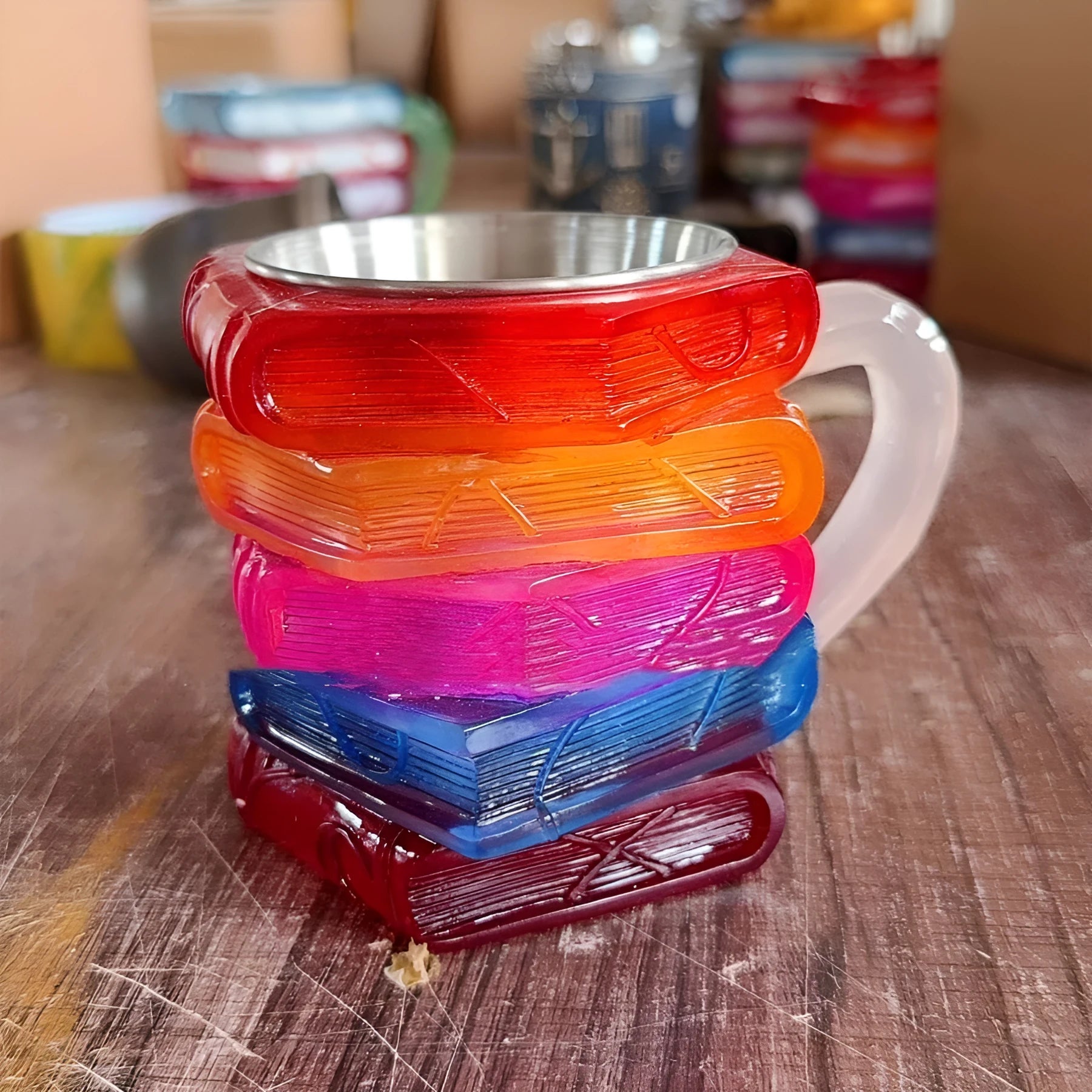 Painted bookmark design on a solid synthetic resin coffee cup decorative ornament.