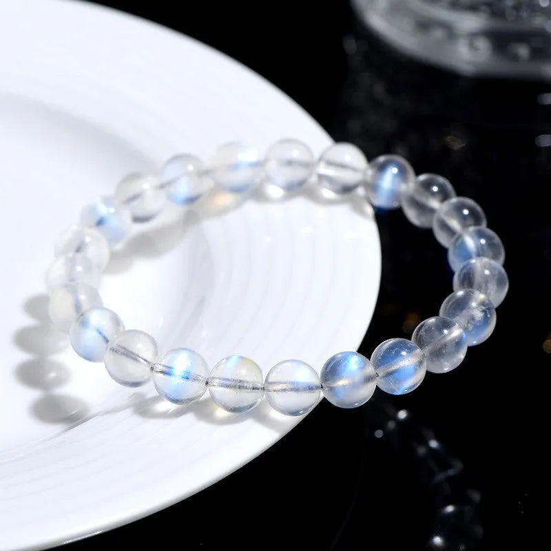 Natural cream body blue moonlight crystal bracelet with grinding finish on wrist