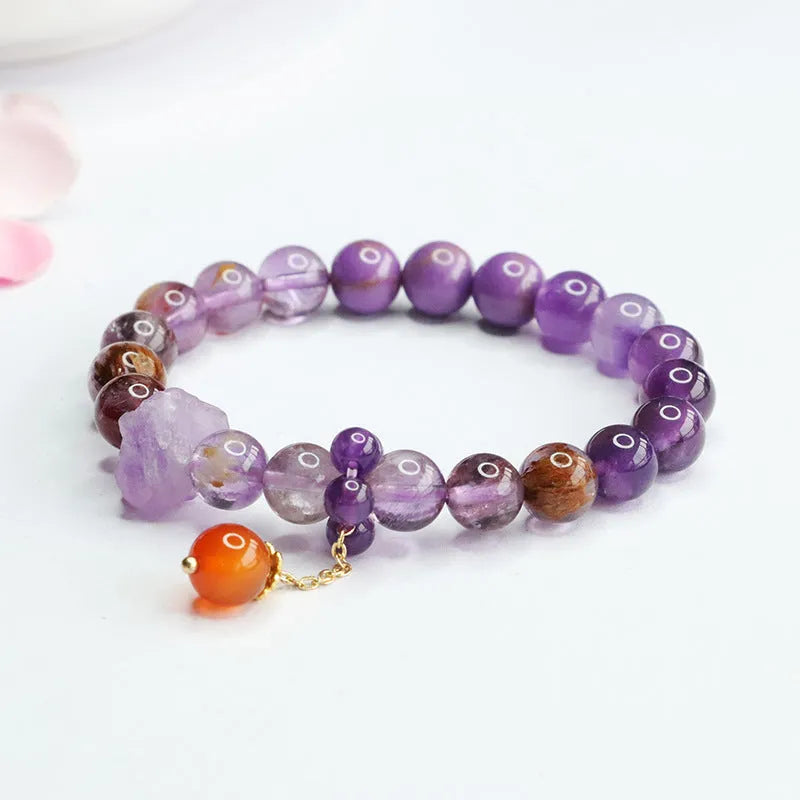 Natural nine purple amethyst bracelet with red agate accents showing 8mm beads