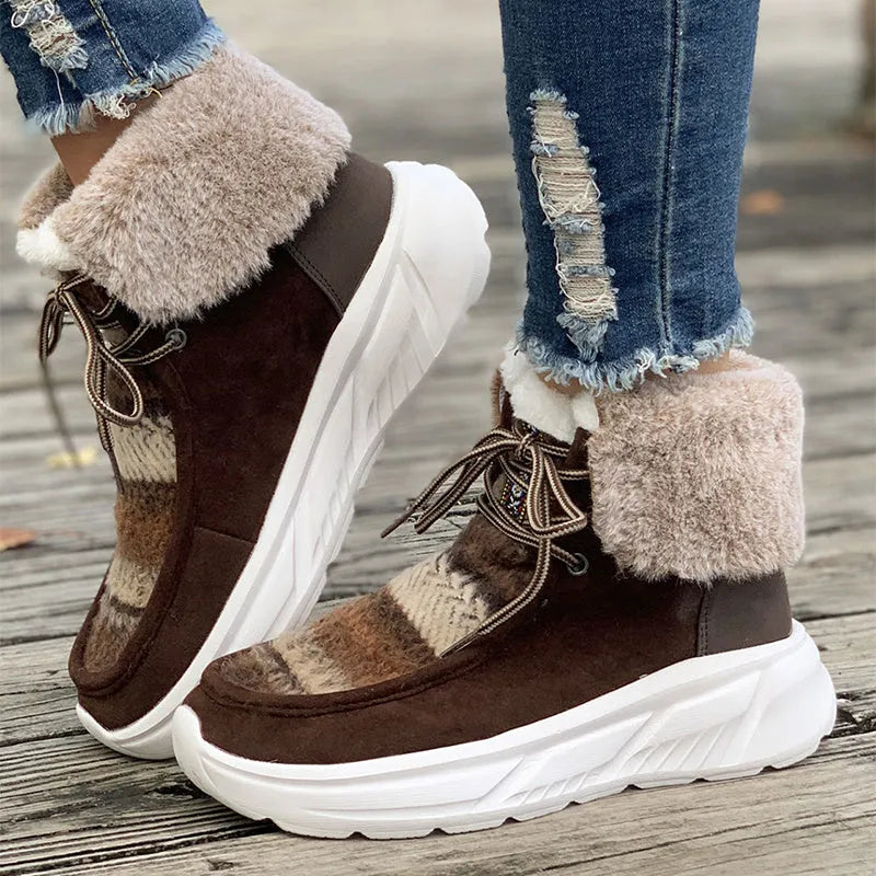 Women's beige lace-up snow boots with suede upper, thick rubber sole, and fuzzy lining on a white background.