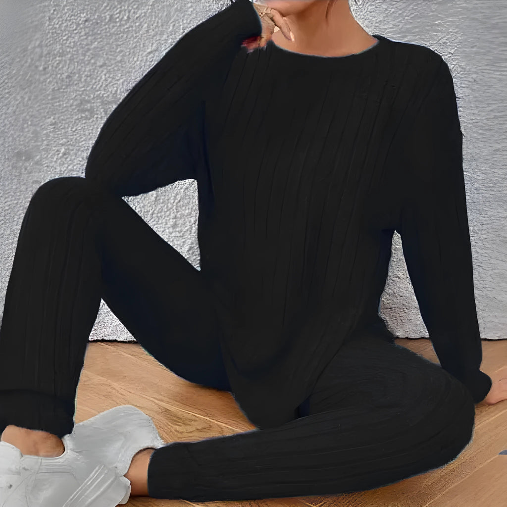 Women's black sunken stripe two-piece homewear set with a regular sleeve top and trousers.