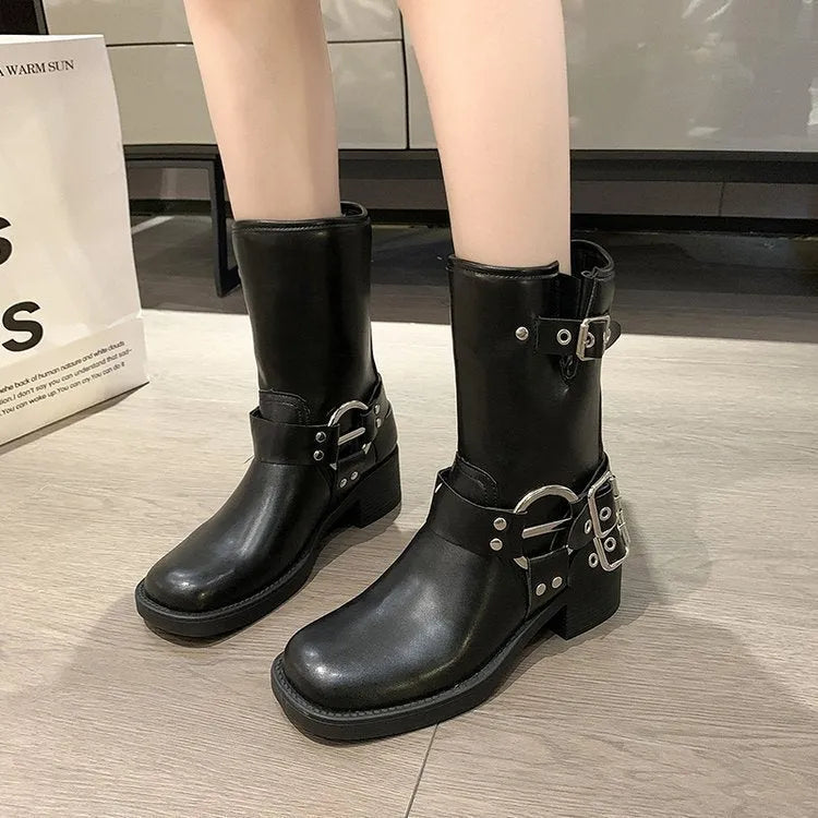 Women's black platform ankle boots with buckle detail and chunky sole