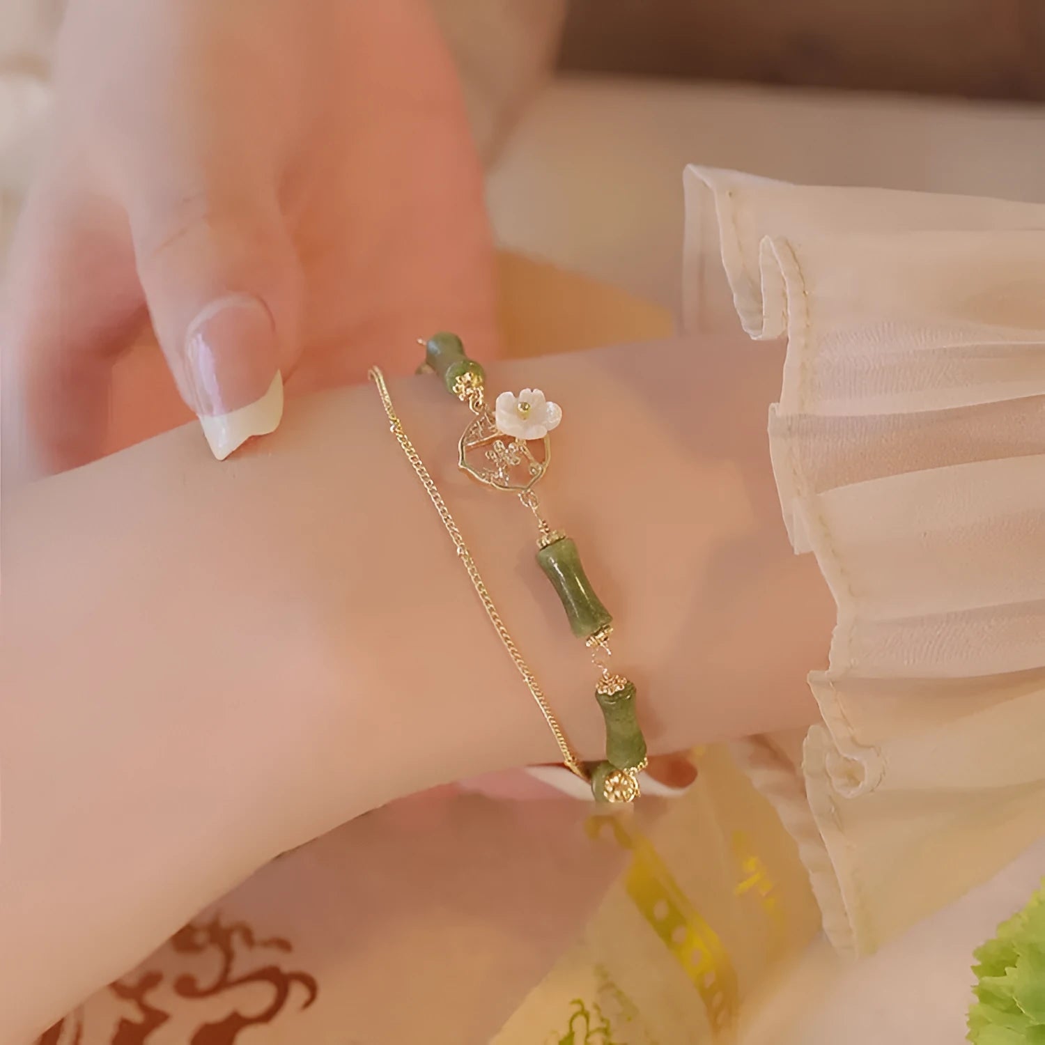 Natural green olivine bracelet with double layer design and Bells of Ireland charms