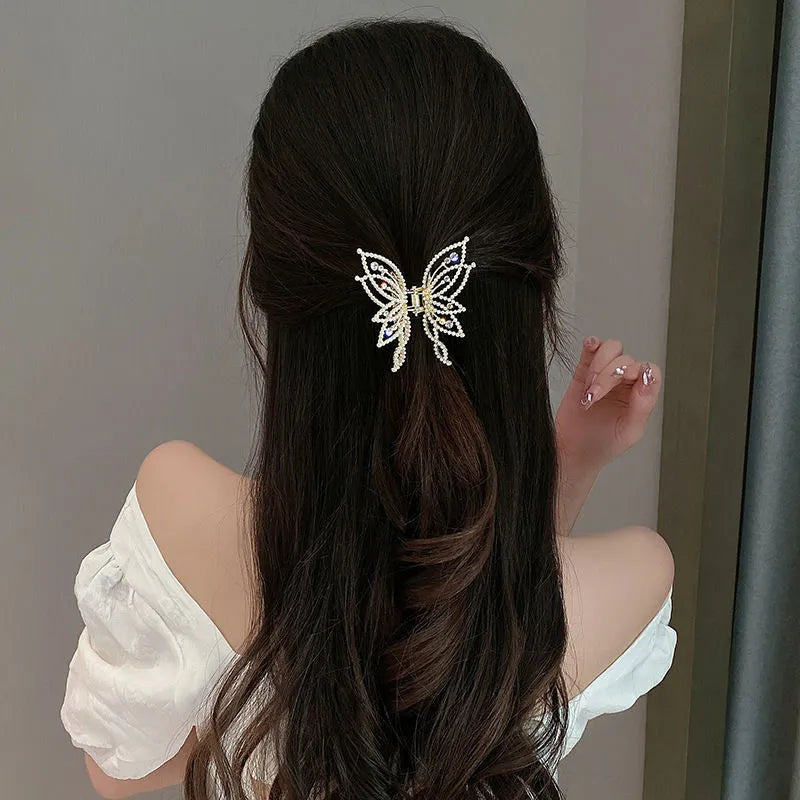 Butterfly hair barrettes in alloy with rhinestone or pearl styles measuring 6.7x6.2cm