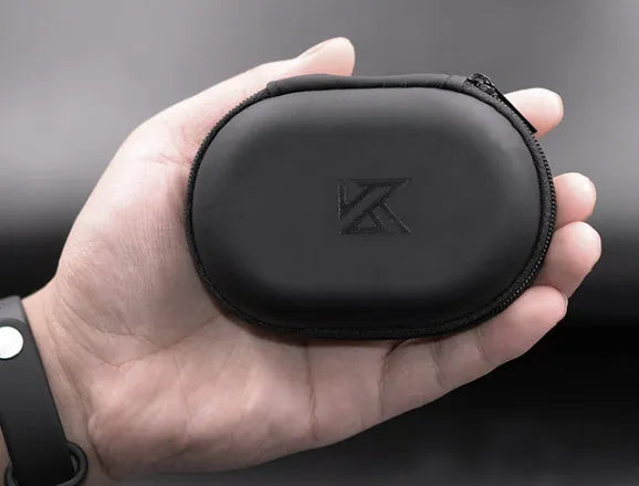 Black oval leather earphone storage bag with zip closure shown closed