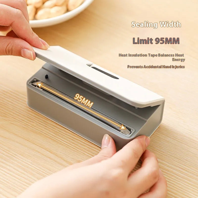 Small blue and white portable manual heat sealing machine for plastic food bags.