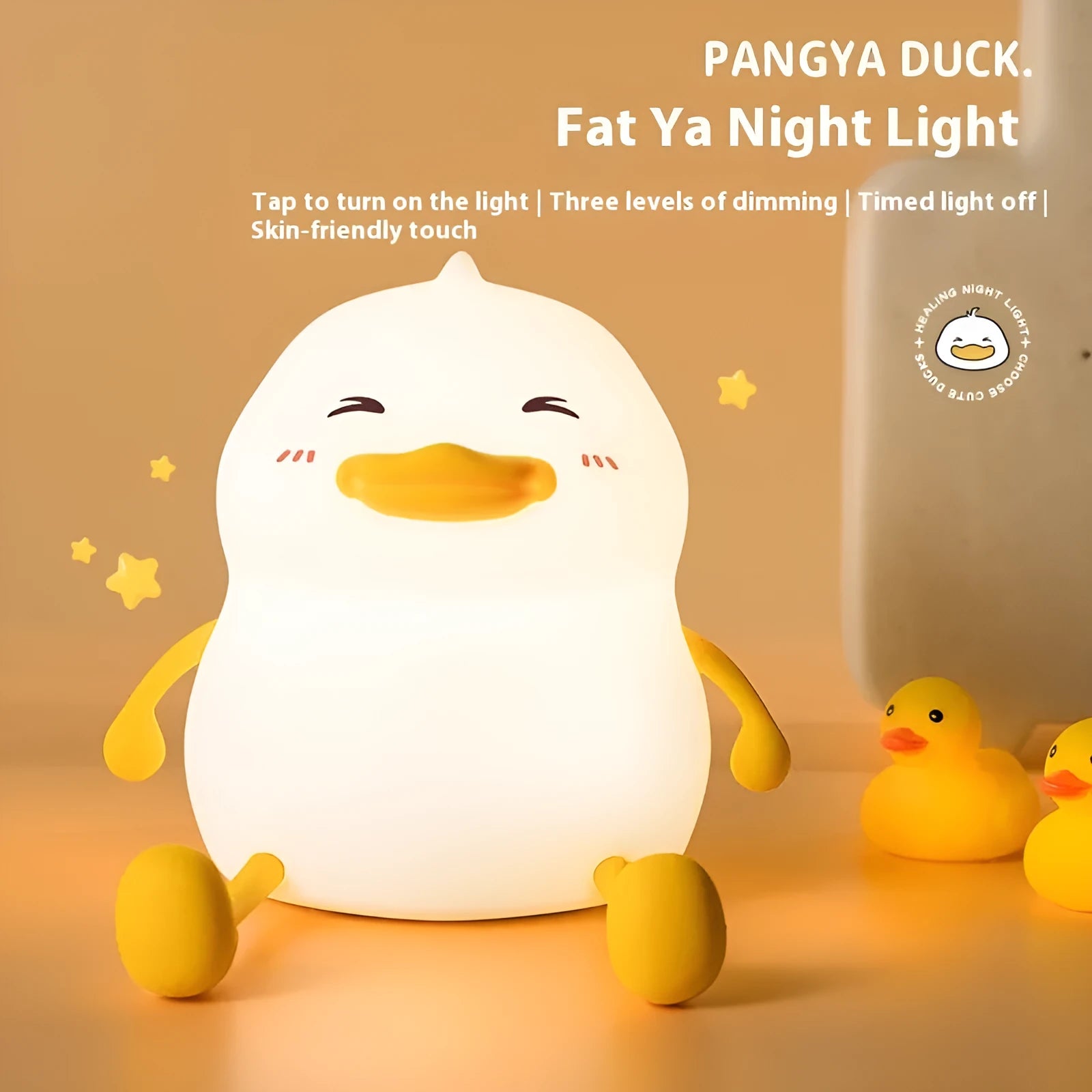 Chubby silicone desktop night light with phone holder showing soft LED illumination