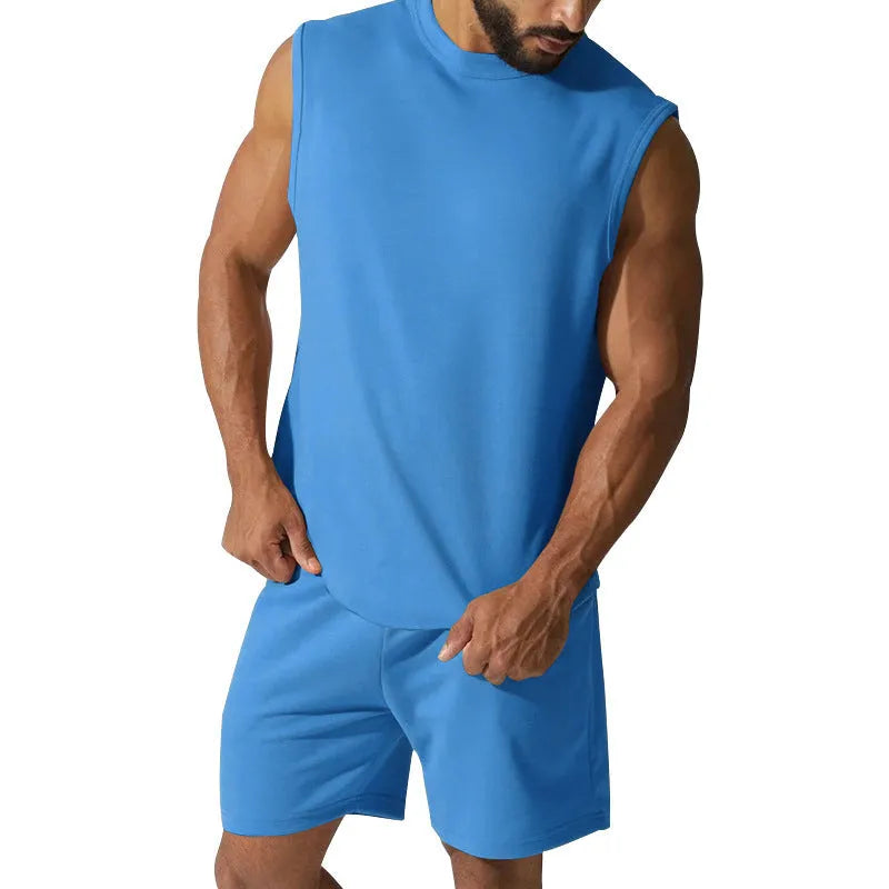 Men's sleeveless cotton blend sports top and matching shorts in a solid colour on a hanger.