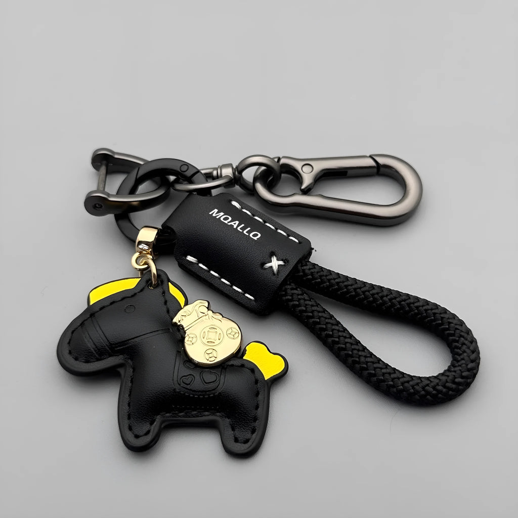 Handmade brown cowhide key pendant with a green flannel rope and a gold-toned horse-shaped buckle.