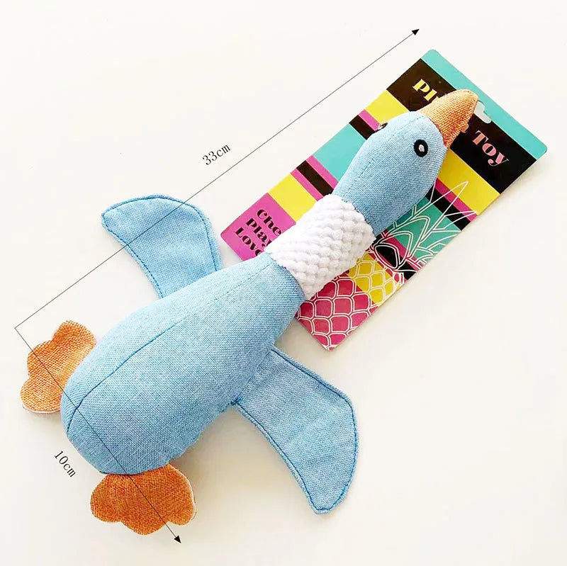 Blue green or grey durable plush duck dog toy with squeaker for chewing and play.