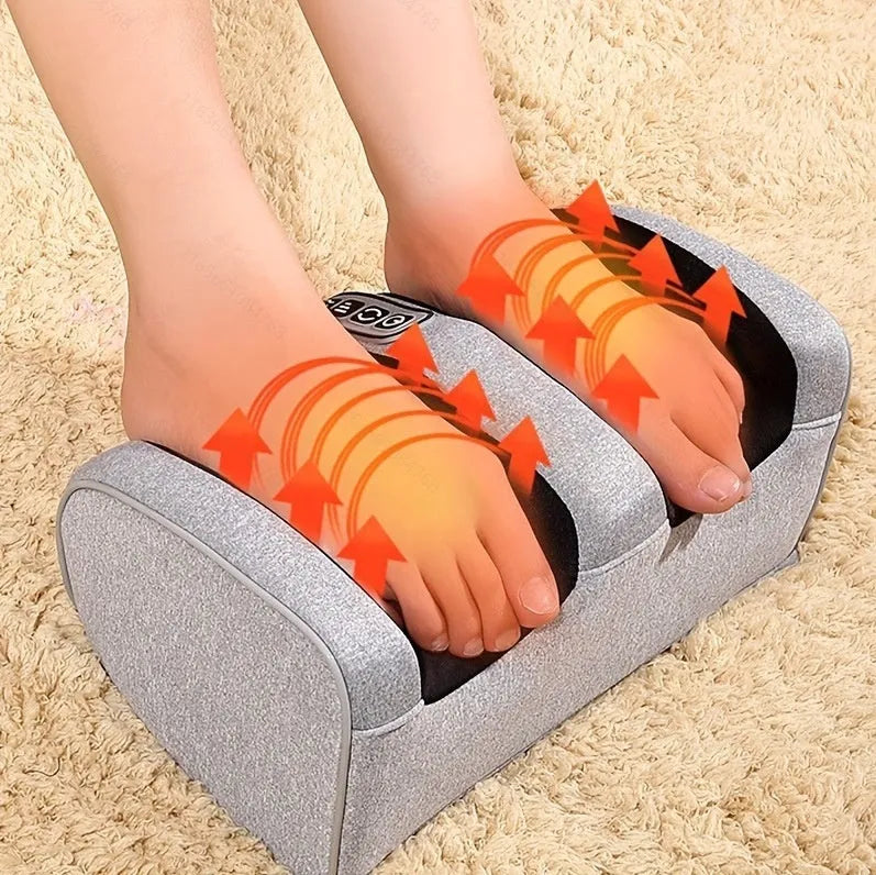 Automatic electric foot massager machine in gold colour with remote control on a wooden floor