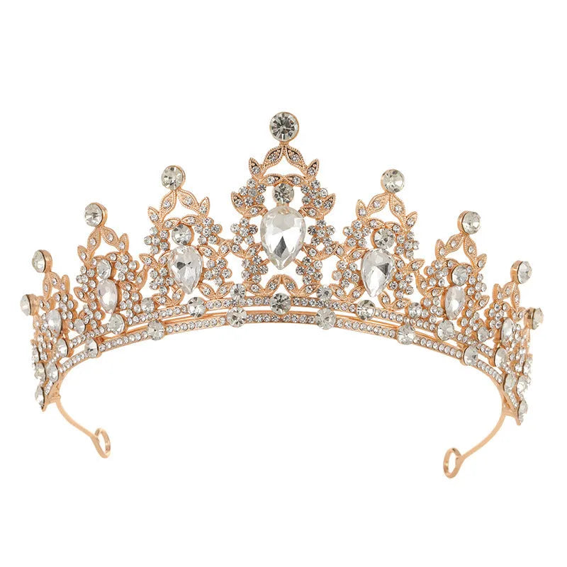 Baroque-style bride crown headdress made of alloy with rhinestone decoration in silver and gold colour options.