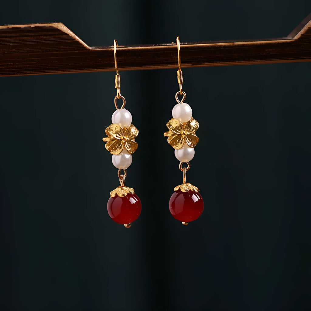 A pair of geometric-shaped vintage court style alloy earrings with an electroplated finish for women.