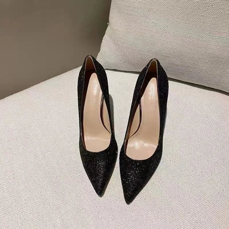 Women's silver wedding stiletto shoes with crystal embellishments on a 9cm heel.