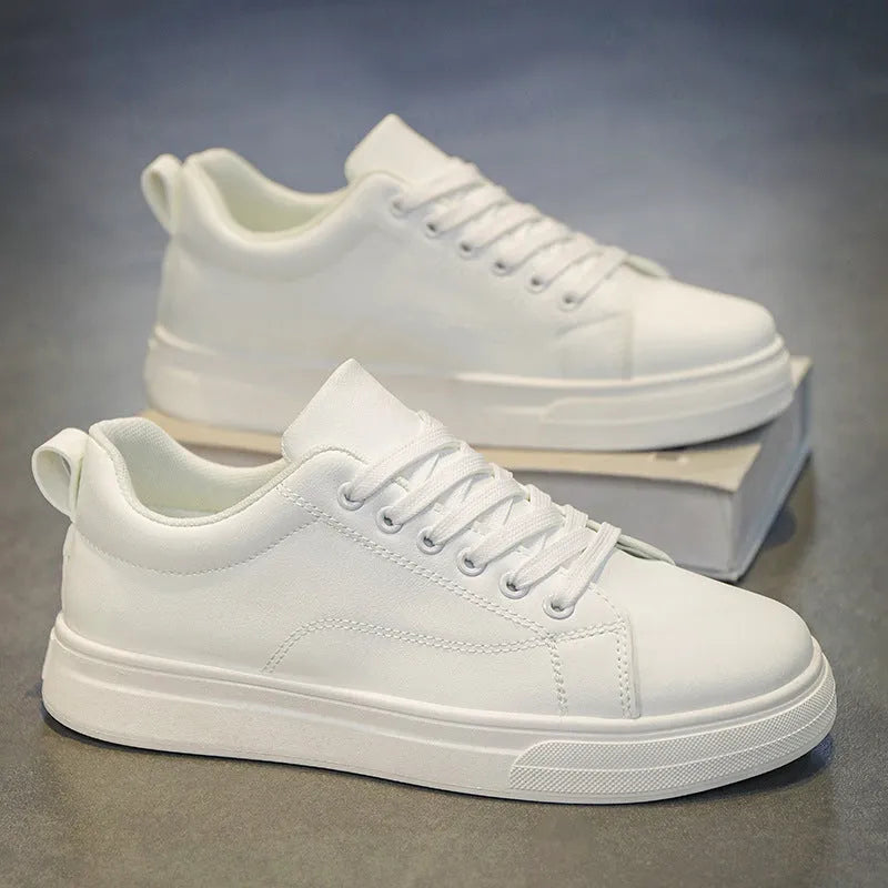 Men's low-top Korean-style casual sneakers in all black colour with a rubber sole.