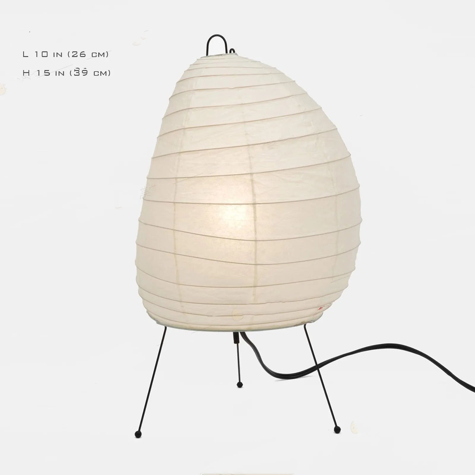 Japanese-style paper table lamp with handmade shade and aluminium base on wooden surface