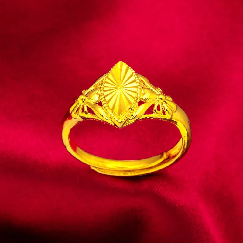 Gold open geometry ring with diamond flower pattern and textured botanical detailing