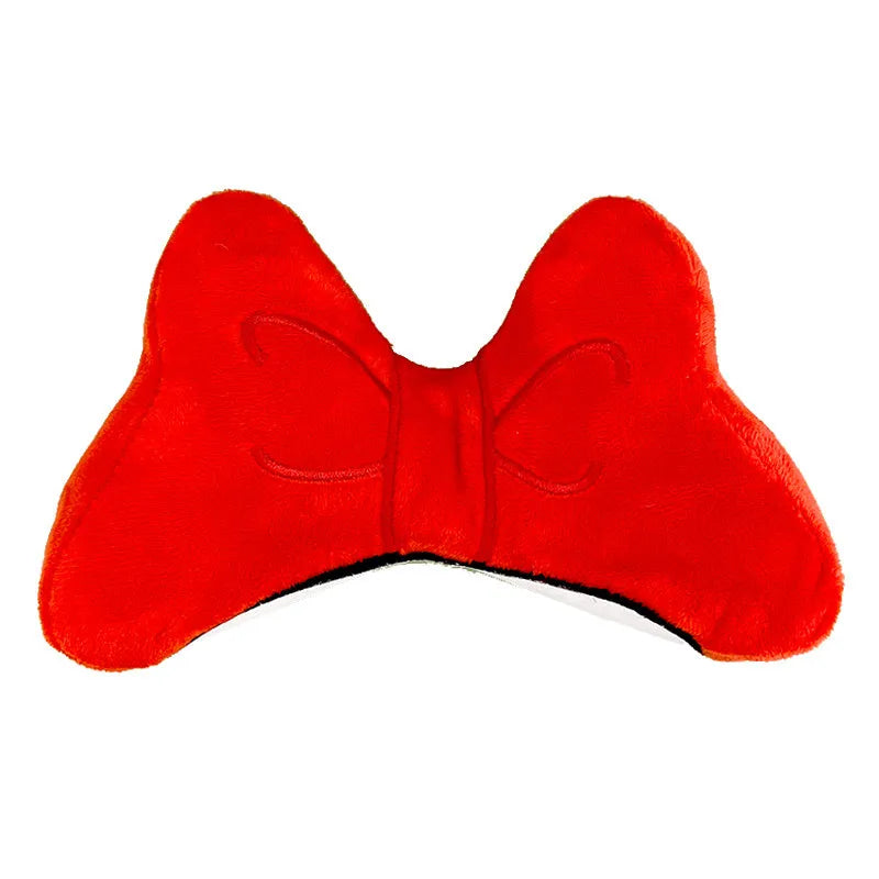 Soft plush bow helmet decoration for motorcycle and ski helmets in red or pink colours.