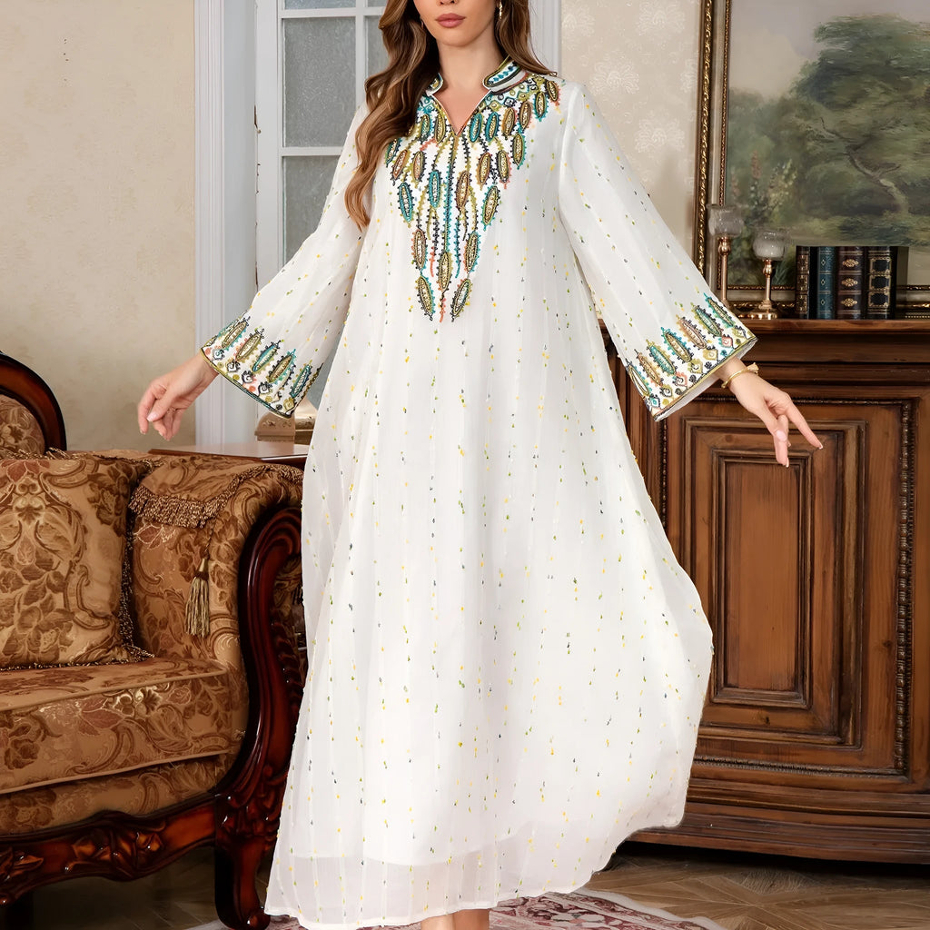 White Dubai-style Arabic robe with long sleeves and full-length skirt on hanger