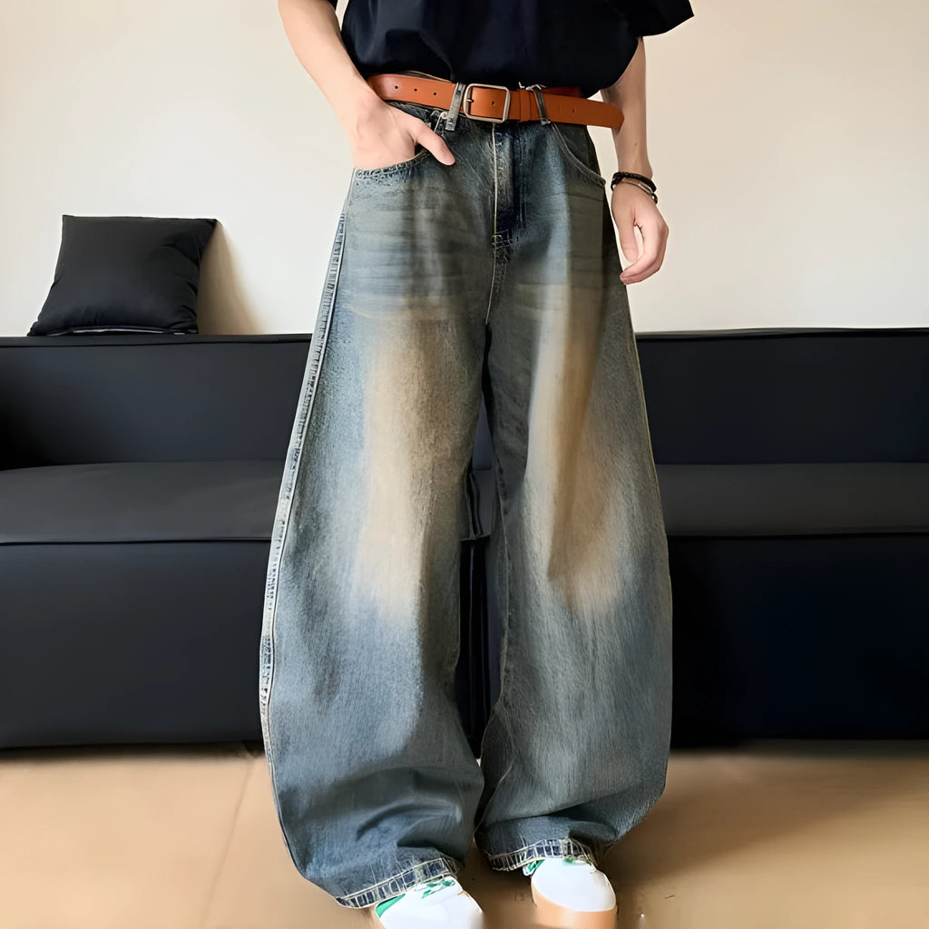 Men's retro blue distressed machete denim jeans with wide-leg silhouette and slim hip fit