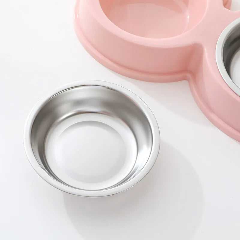 Stainless steel pet double bowl with frog design showing separate food and water compartments