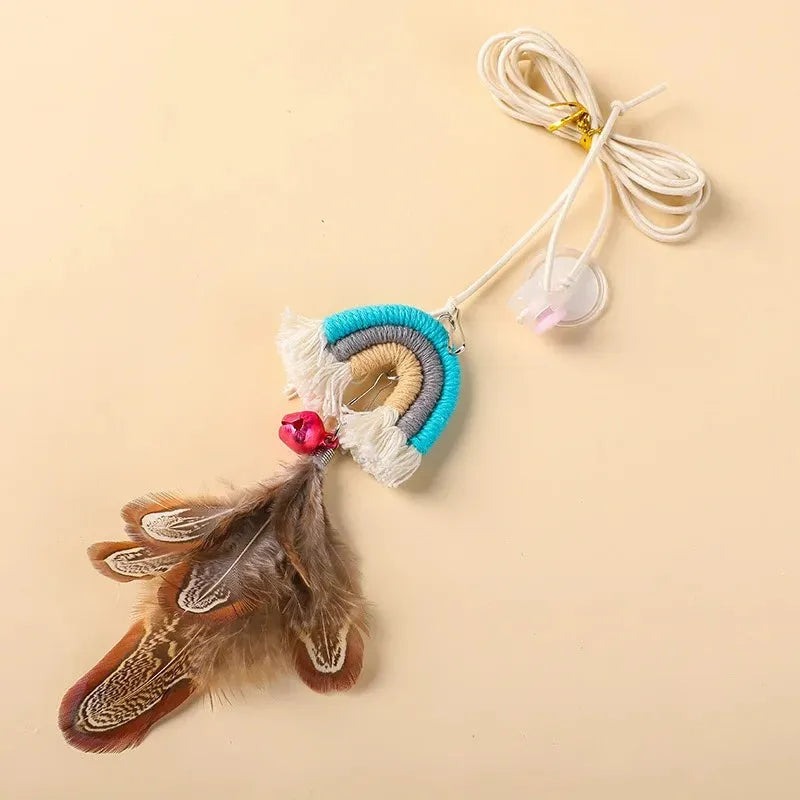 Blue feather cat toy hanging from door with elastic rope and sticky buckle clamp for interactive play