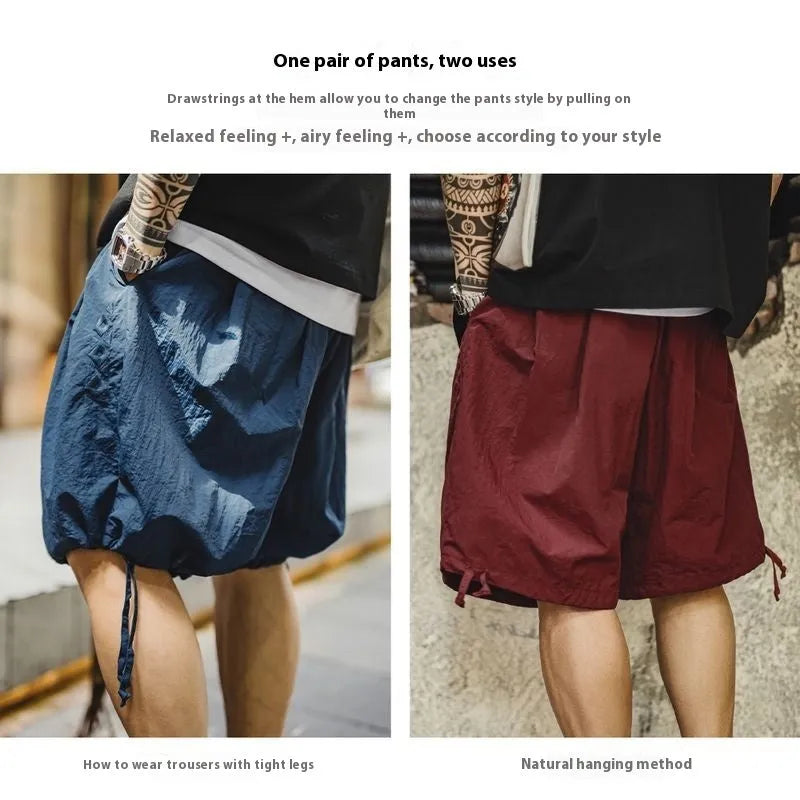 Men's embroidered loose fit beach shorts in Prussian blue colour, lightweight nylon fabric