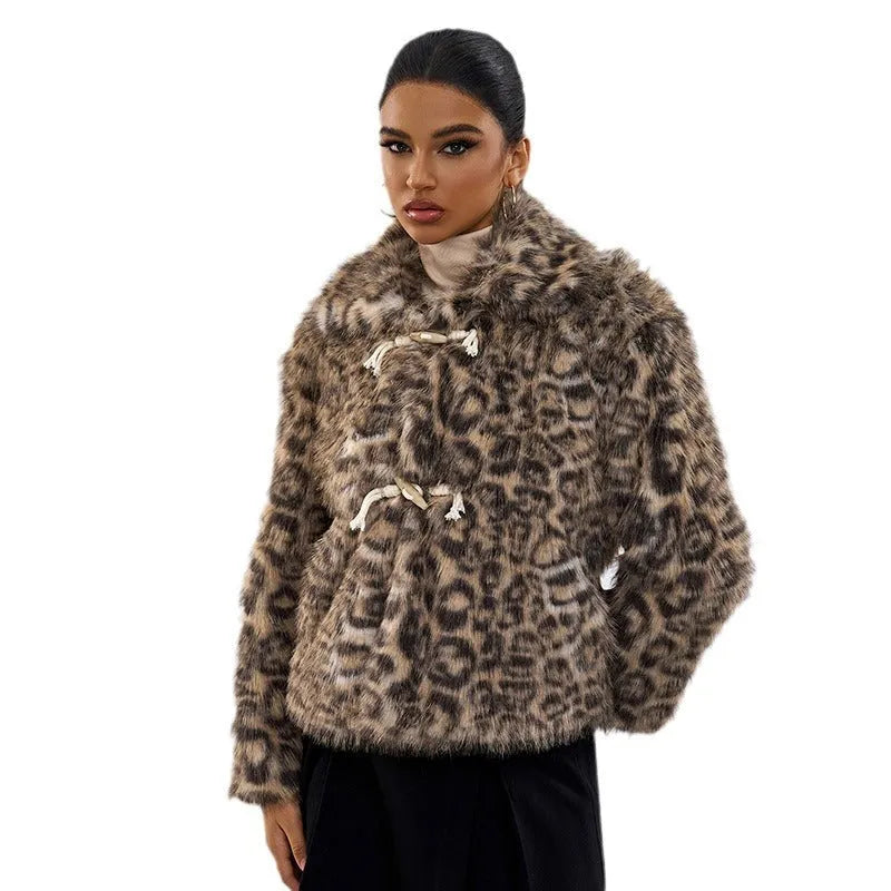 Women's leopard print street fashion coat with regular sleeves on a hanger.