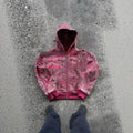 A man's loose-fitting red hooded zip-up coat with long sleeves, shown on a size chart.