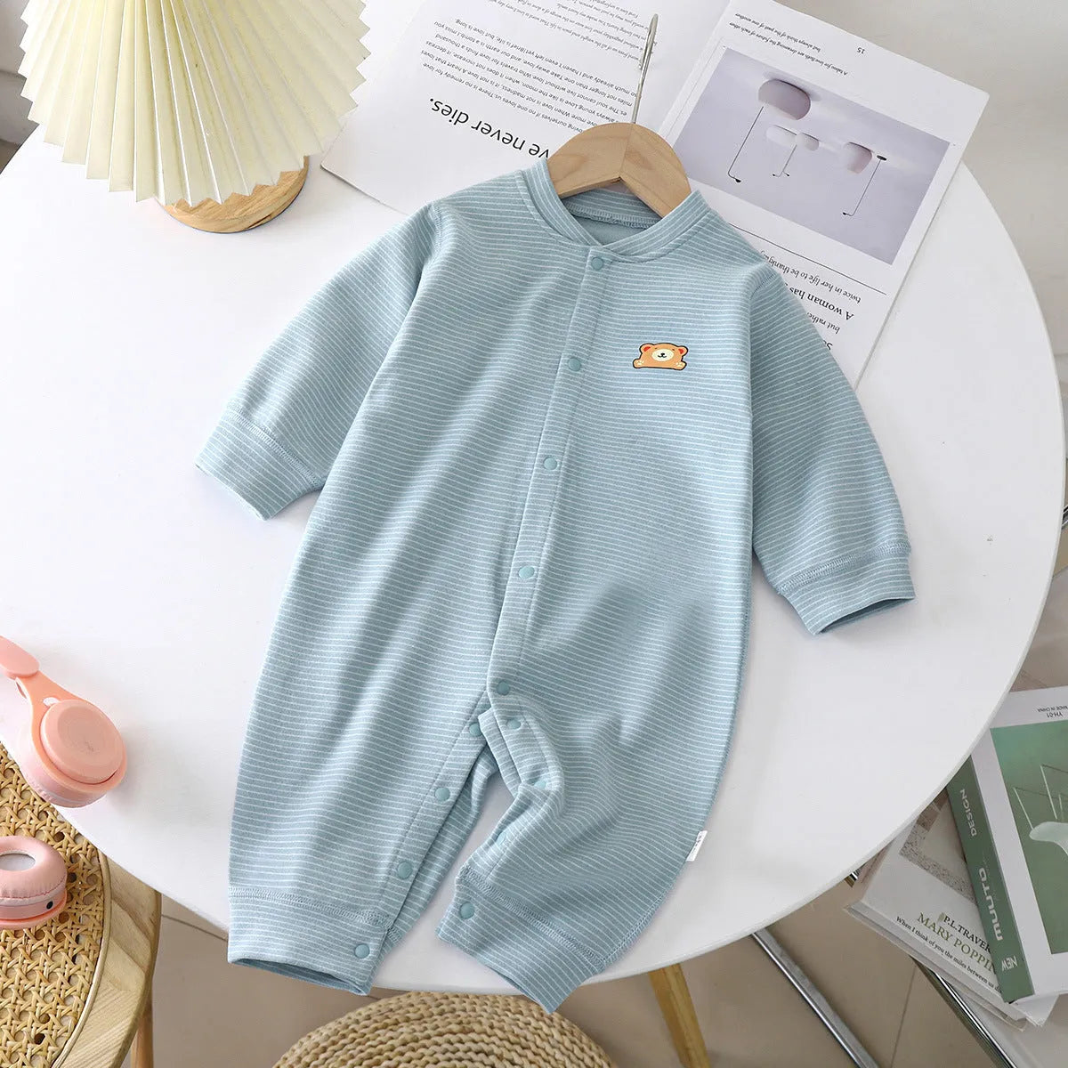 Baby Dralon striped jumpsuit romper in bean green with long sleeves and hide hook closure on white background