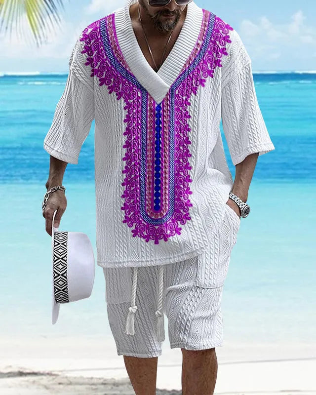 Man wearing a grey printed knitted short-sleeved top with drop shoulders and matching shorts, a casual two-piece suit set.