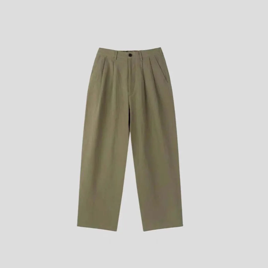Men's light-weight apricot coloured cotton linen trousers with a loose Korean fit and pencil leg opening.