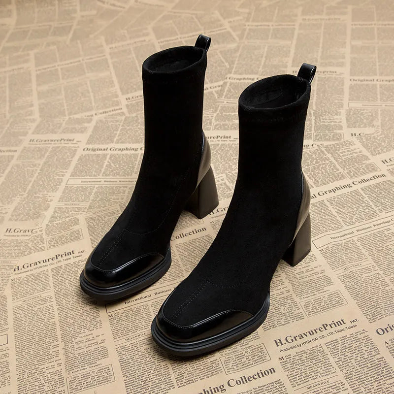 Genuine leather women's short martin boots in black matte finish with high heel and rubber sole