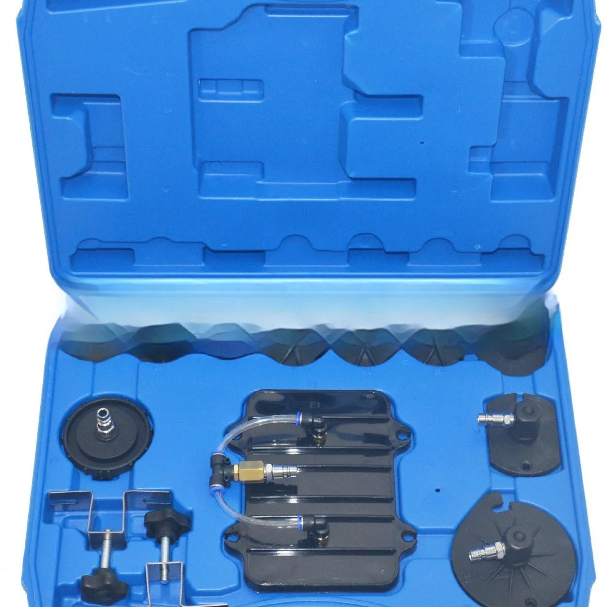 Pneumatic brake fluid replacement tool with 5L tank, pressure gauge, adapter kit, collection bottle, and fluid hose on a workbench