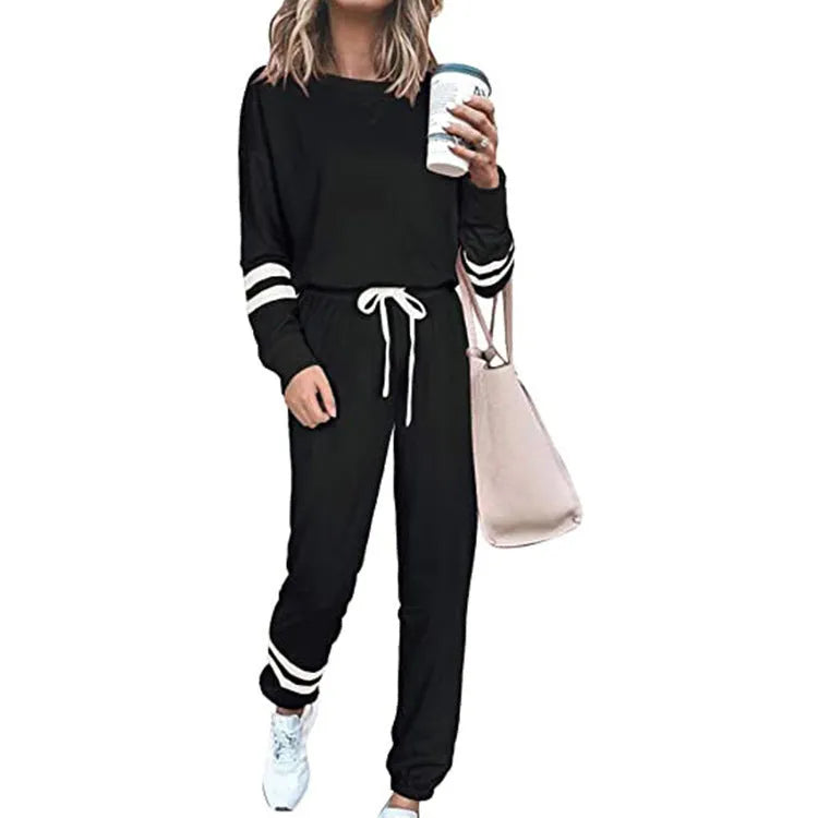 Women's plus size loose-fitting casual suit set in a solid colour with half-length sleeves.