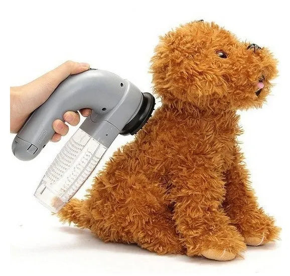 Grey portable electric pet hair vacuum cleaner with soft rubber head for dogs and cats.