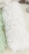 Plush cat toy pillow in blue, green, pink, or white colours measuring 27cm long by 10cm wide
