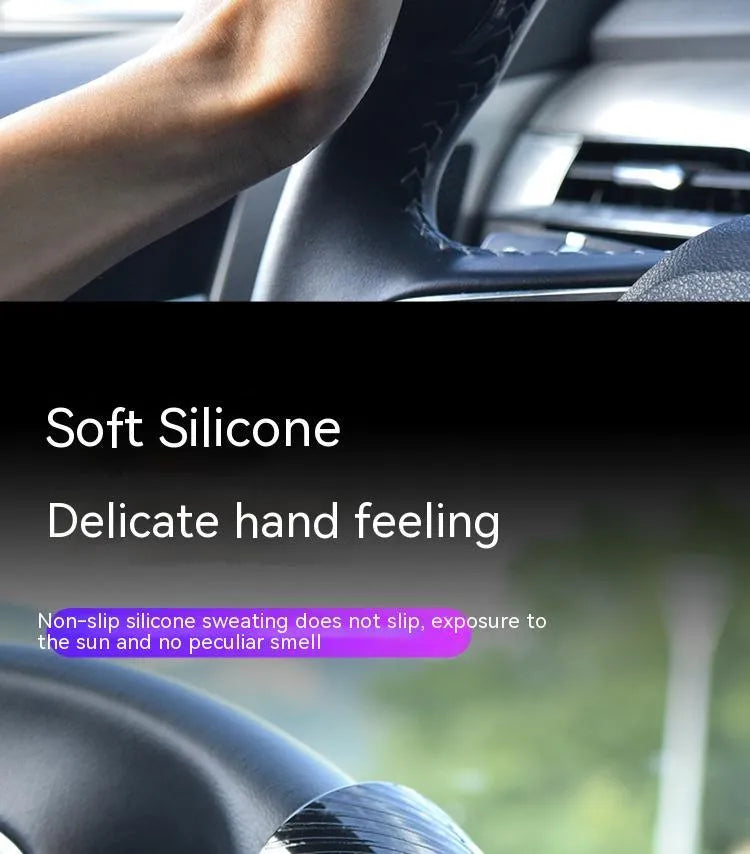 Silicone steering wheel assist ball with metal bearing in black or blue colour, approximately 9cm by 6cm