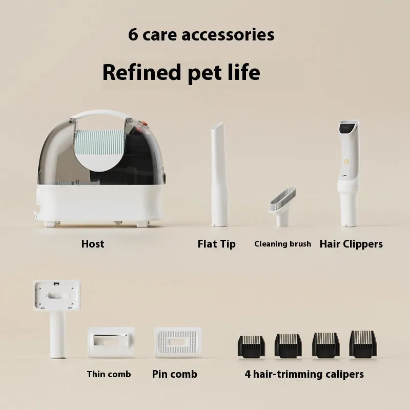 Pink and white pet grooming vacuum cleaner with hair clipper attachment and accessories on a white background.